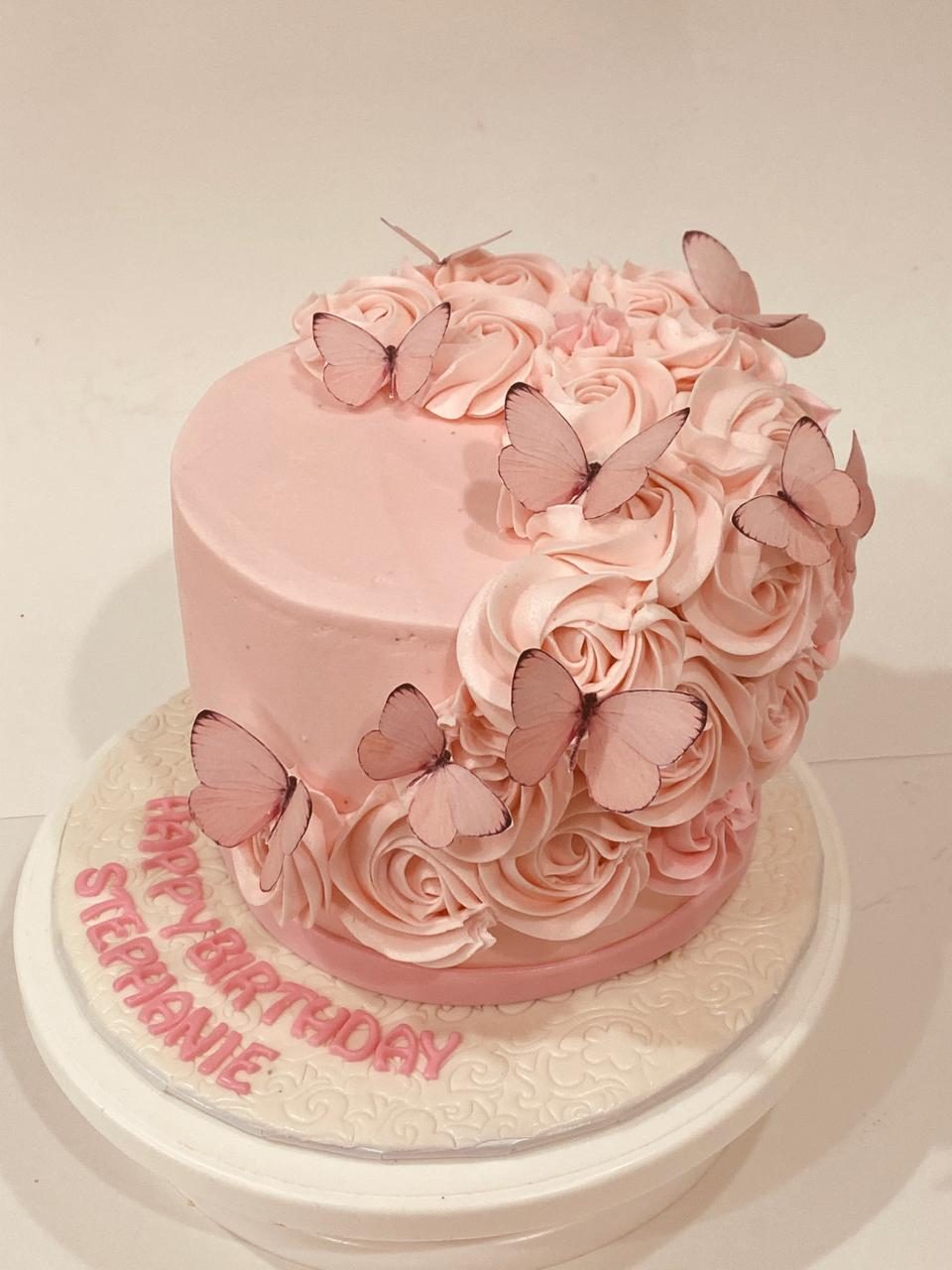 Pink rosette butterfly cake